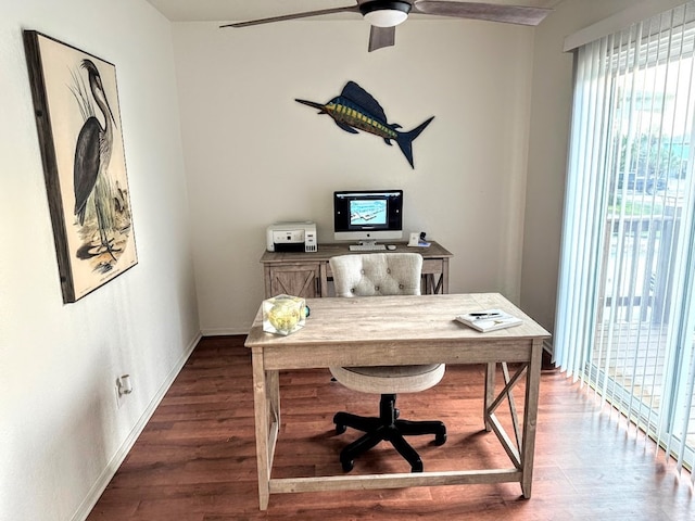 office with a ceiling fan, baseboards, and wood finished floors