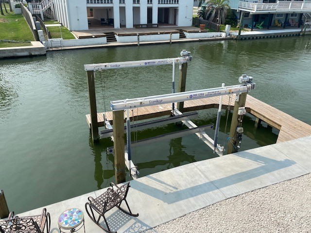 view of dock with a water view and boat lift