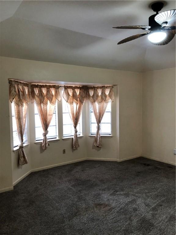 carpeted empty room with ceiling fan