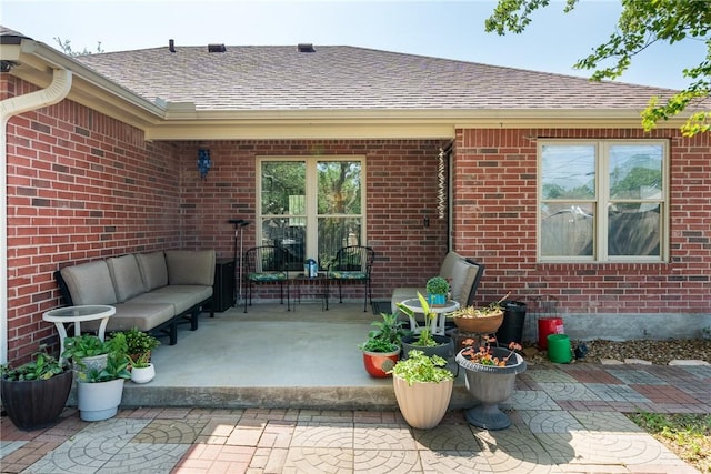 109 Starlight, Ingleside, TX 78362 - rear view of property featuring a shingled roof, brick siding, and an outdoor hangout area