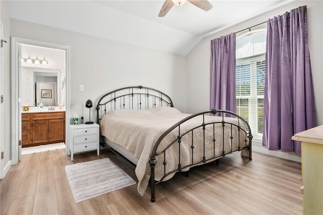 109 Starlight, Ingleside, TX 78362 - bedroom with ensuite bathroom, vaulted ceiling, light wood finished floors, ceiling fan, and baseboards