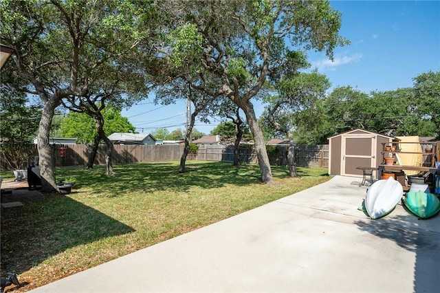 109 Starlight, Ingleside, TX 78362 - view of yard with a patio area, an outdoor structure, a fenced backyard, and a storage unit