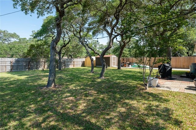 109 Starlight, Ingleside, TX 78362 - view of yard with a fenced backyard, a patio, a shed, and an outbuilding