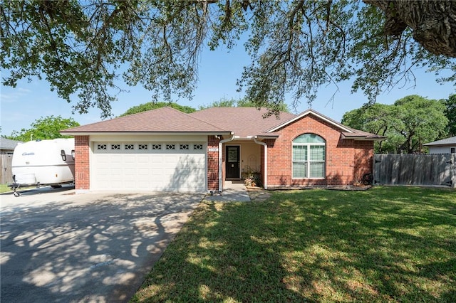 109 Starlight, Ingleside, TX 78362 - ranch-style house featuring an attached garage, brick siding, driveway, and fence