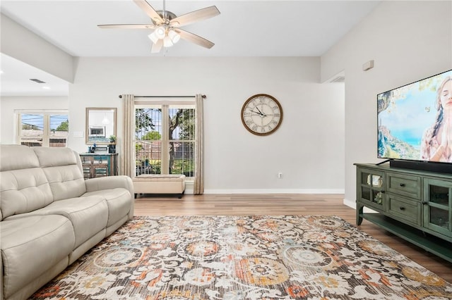 109 Starlight, Ingleside, TX 78362 - living room featuring wood finished floors, a ceiling fan, and a healthy amount of sunlight