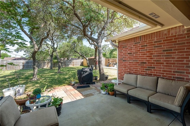 109 Starlight, Ingleside, TX 78362 - view of patio with an outbuilding, a fenced backyard, an outdoor living space, and a shed