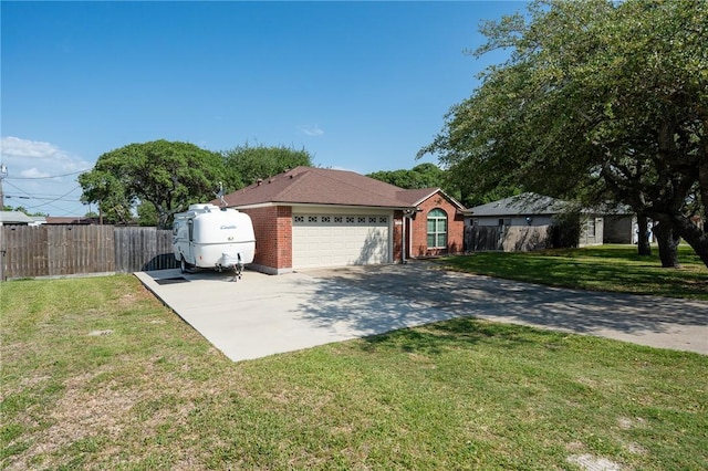 109 Starlight, Ingleside, TX 78362 - ranch-style house featuring a front lawn, brick siding, fence, and a garage