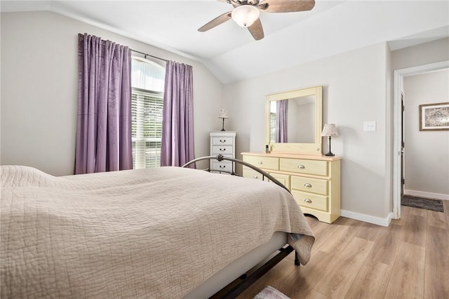 109 Starlight, Ingleside, TX 78362 - bedroom with baseboards, light wood-style floors, ceiling fan, and vaulted ceiling