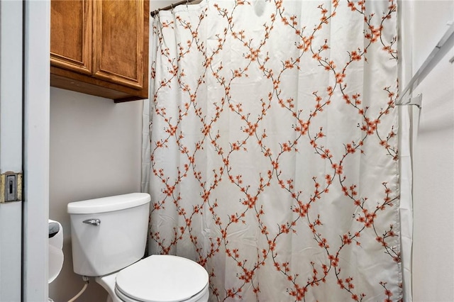 109 Starlight, Ingleside, TX 78362 - bathroom with toilet and a shower with shower curtain