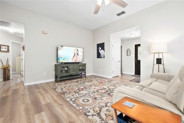 109 Starlight, Ingleside, TX 78362 - living area with baseboards, ceiling fan, light wood-style floors, and visible vents