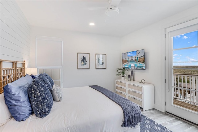 bedroom with access to exterior, light hardwood / wood-style floors, and ceiling fan