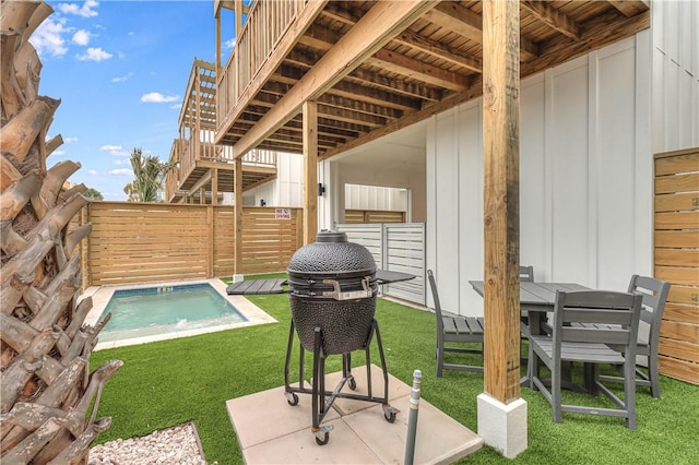 view of pool featuring a patio area and a yard