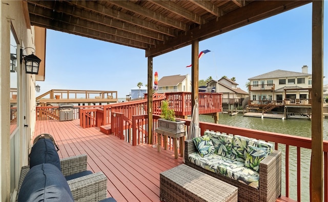 wooden deck featuring a water view