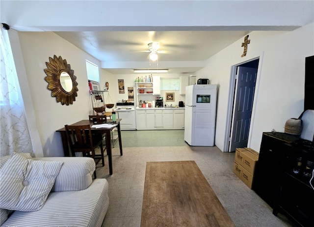 living room with a ceiling fan