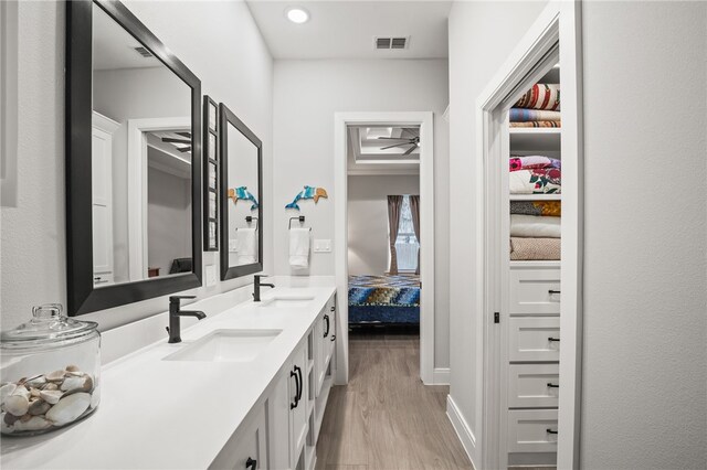 bathroom featuring shower / tub combo, hardwood / wood-style flooring, toilet, and plenty of natural light