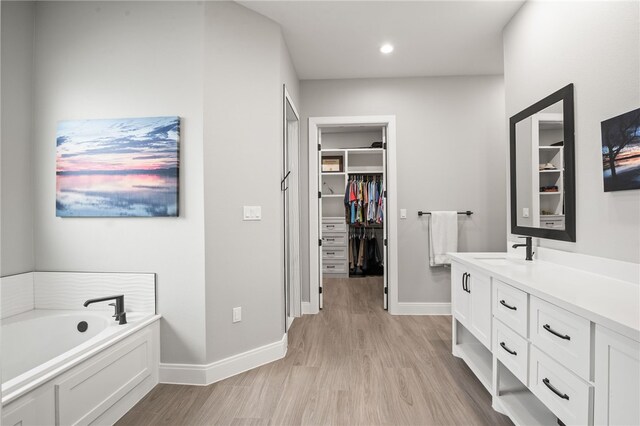 bathroom featuring hardwood / wood-style floors and a bathtub