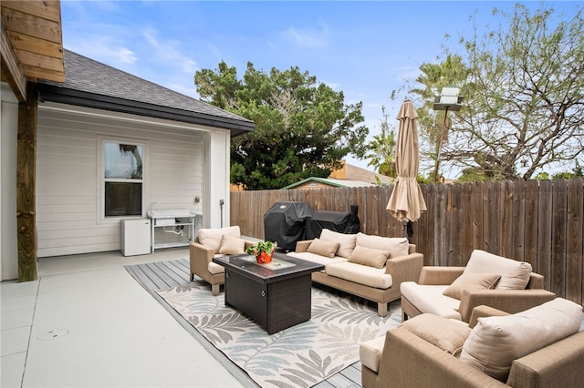 view of patio / terrace featuring a grill and an outdoor hangout area