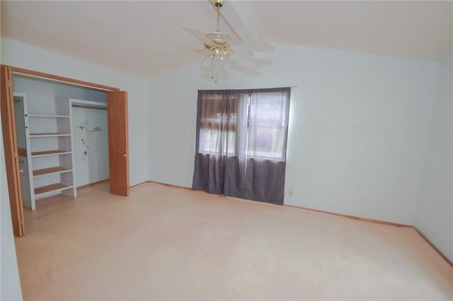 unfurnished bedroom with lofted ceiling, ceiling fan, and carpet floors
