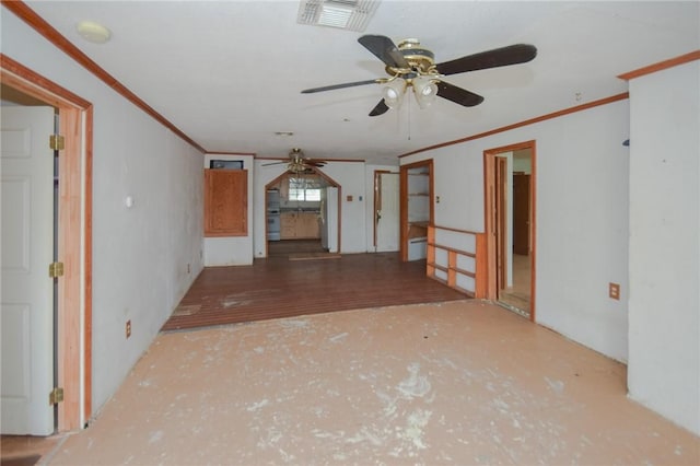 unfurnished room featuring ceiling fan, crown molding, and visible vents