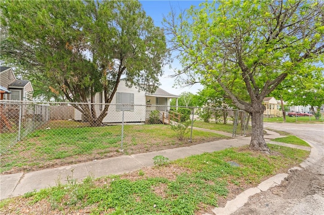 view of front of property with a front lawn and fence