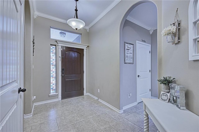 6730 Old Square Dr, Corpus Christi, TX 78414 - foyer entrance with crown molding, healthy amount of natural light, arched walkways, and light tile patterned floors