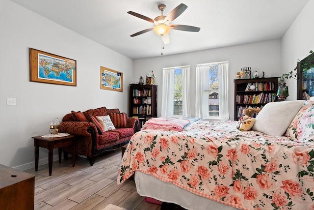 1928 Estes Flats Dr, Aransas Pass, TX 78336 - bedroom featuring light wood finished floors, a ceiling fan, and baseboards