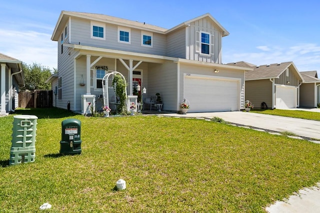 1928 Estes Flats Dr, Aransas Pass, TX 78336 - view of front of property featuring board and batten siding, driveway, a garage, and covered porch