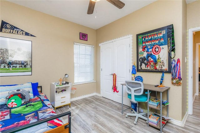 office with ceiling fan, wood finished floors, and baseboards