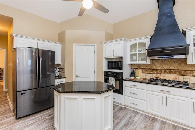 kitchen with white cabinetry, appliances with stainless steel finishes, tasteful backsplash, glass insert cabinets, and custom range hood