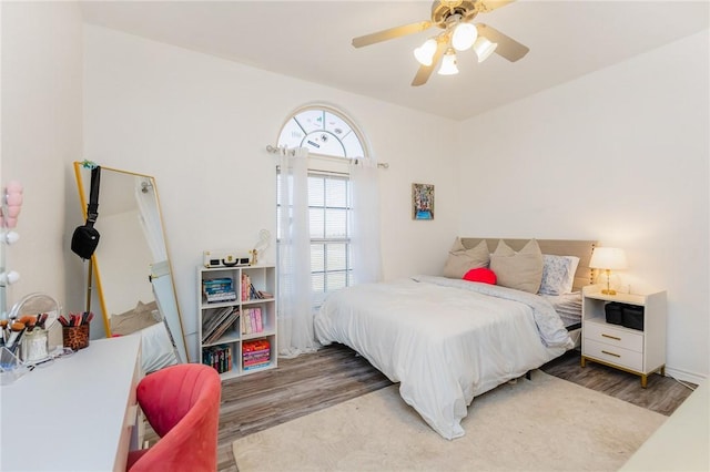 bedroom with wood finished floors and a ceiling fan