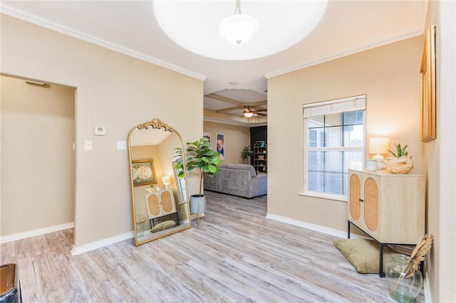 foyer featuring ornamental molding, wood finished floors, and baseboards