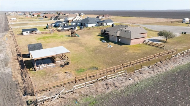 birds eye view of property featuring a rural view