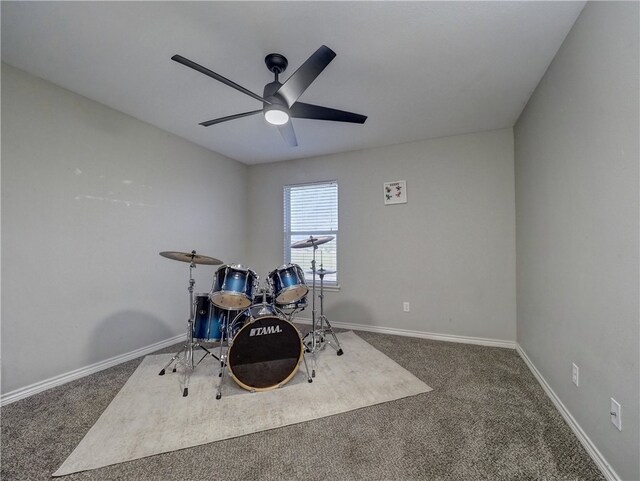 misc room with carpet floors and ceiling fan