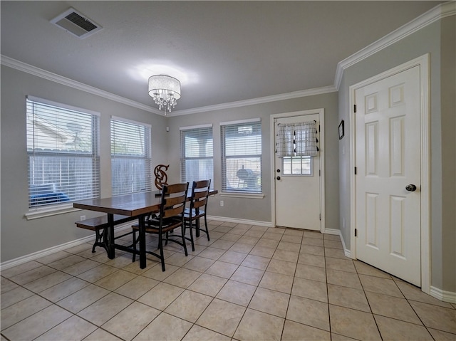 dining space featuring ornamental molding, plenty of natural light, and light tile patterned floors