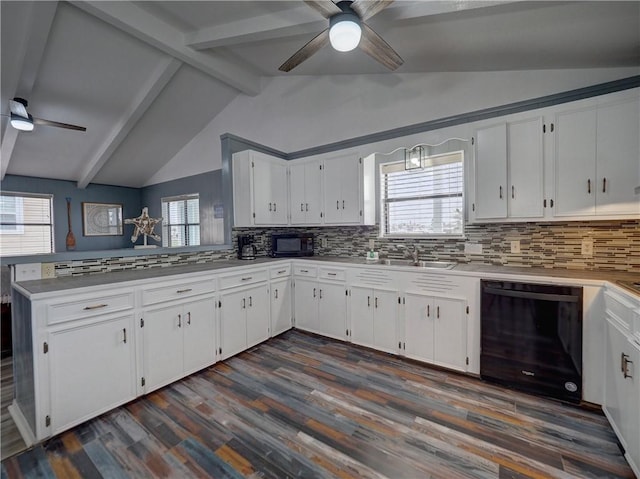kitchen with black appliances, ceiling fan, a sink, and decorative backsplash