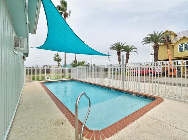 community pool featuring fence