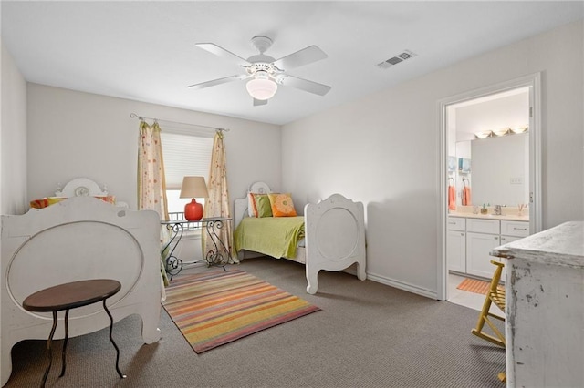 127 Sea Mist Dr, Aransas Pass, TX 78336 - carpeted bedroom featuring connected bathroom, a sink, ceiling fan, and baseboards