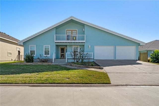 127 Sea Mist Dr, Aransas Pass, TX 78336 - view of front of property featuring a balcony, driveway, a porch, a front lawn, and an attached garage