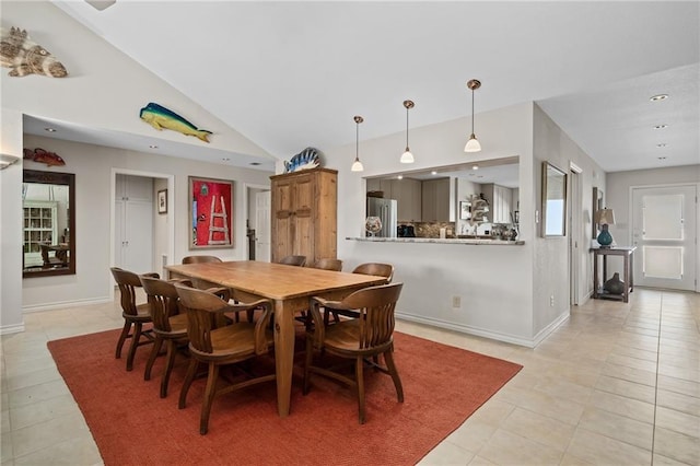 127 Sea Mist Dr, Aransas Pass, TX 78336 - dining space with light tile patterned floors, baseboards, lofted ceiling, and recessed lighting