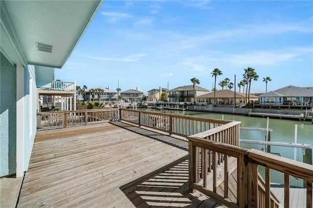 127 Sea Mist Dr, Aransas Pass, TX 78336 - wooden deck featuring a water view and a residential view
