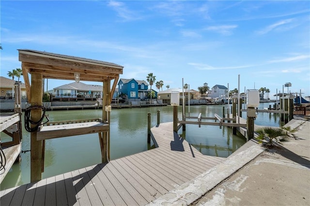 127 Sea Mist Dr, Aransas Pass, TX 78336 - dock area featuring boat lift, a water view, and a residential view