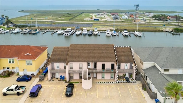 birds eye view of property featuring a water view