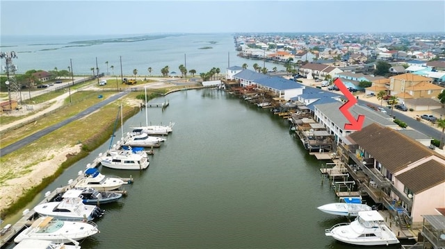 birds eye view of property featuring a water view