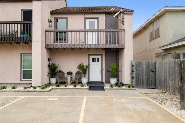 view of front of home with a balcony