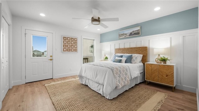 bedroom with wood-type flooring, a closet, and ceiling fan