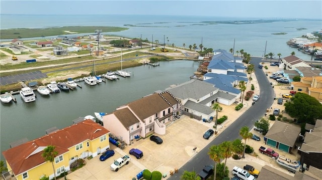 birds eye view of property featuring a water view