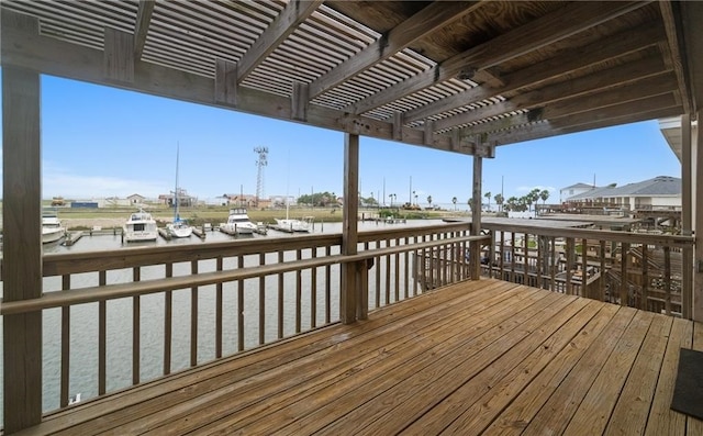 wooden terrace with a pergola and a water view