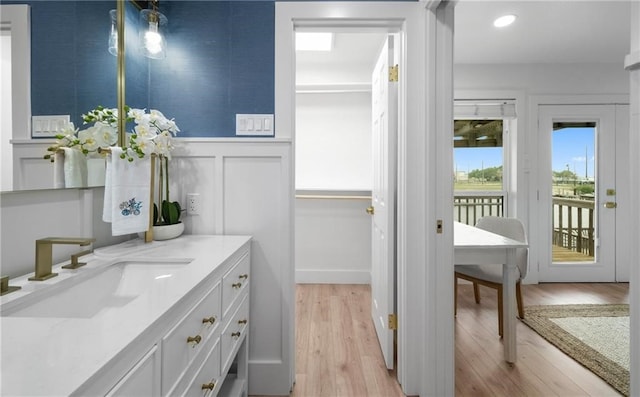 bathroom with vanity and wood-type flooring