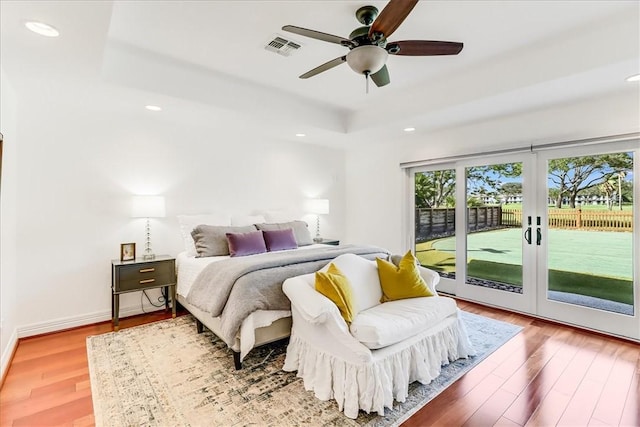5241 Saint Andrews Dr, Corpus Christi, TX 78413 - bedroom with a raised ceiling, access to outside, wood finished floors, recessed lighting, and a ceiling fan