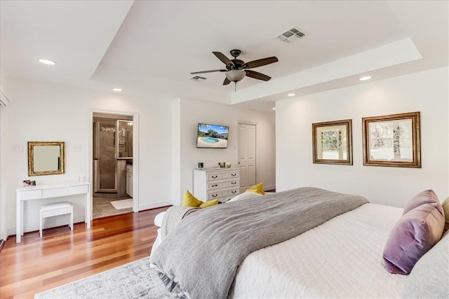 5241 Saint Andrews Dr, Corpus Christi, TX 78413 - bedroom with light wood-style flooring, a tray ceiling, recessed lighting, baseboards, and a ceiling fan